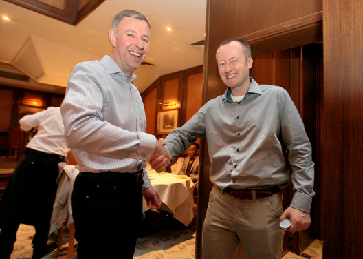 Two participants shaking hands at a study programme event